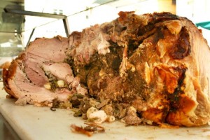 Porchetta is whole roast pig sold from vans on the side of the road in Italy